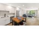 Open kitchen with butcher block island, stainless appliances and views into the living room at 420 63Rd St # B East, Holmes Beach, FL 34217