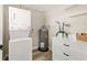 Convenient laundry room equipped with a stacked washer/dryer and plenty of storage space at 420 63Rd St # B East, Holmes Beach, FL 34217