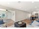 Bright living room with wood floors, neutral paint, and views into kitchen at 420 63Rd St # B East, Holmes Beach, FL 34217