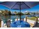 Waterfront patio with table and chairs, perfect for outdoor dining at 420 63Rd St # B East, Holmes Beach, FL 34217