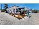 Outdoor patio with seating, perfect for enjoying the waterfront view at 420 63Rd St # B East, Holmes Beach, FL 34217