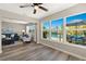 A bright sun room with water views connects seamlessly to the living room creating a great flow at 420 63Rd St # B East, Holmes Beach, FL 34217