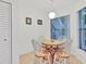 Cozy breakfast nook with a round wooden table and large window letting in natural light at 4315 45Th W Ave # 103, Bradenton, FL 34210