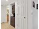 Hallway view into the laundry and bathroom, showing convenient accessibility at 4315 45Th W Ave # 103, Bradenton, FL 34210