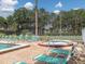 Inviting community hot tub provides relaxation, complemented by nearby swimming pool and comfortable lounge seating at 4315 45Th W Ave # 103, Bradenton, FL 34210