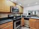 Bright kitchen with stainless steel appliances and granite countertops at 4315 45Th W Ave # 103, Bradenton, FL 34210
