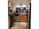 Modern kitchen featuring stainless steel appliances and sleek countertops at 4315 45Th W Ave # 103, Bradenton, FL 34210