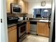 Efficient kitchen featuring modern appliances and ample cabinet space at 4315 45Th W Ave # 103, Bradenton, FL 34210