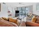 Inviting living room with comfortable seating, open layout, and access to patio and bedroom at 4315 45Th W Ave # 103, Bradenton, FL 34210