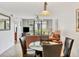 Cozy living and dining area with tile flooring and modern furnishings, perfect for relaxing and entertaining guests at 4315 45Th W Ave # 103, Bradenton, FL 34210