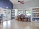 Bright, airy room with a library, workspace and double doors to the outdoors at 4315 45Th W Ave # 103, Bradenton, FL 34210
