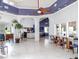 A spacious room with tile floors, complemented by elegant blue decor and tall ceilings at 4315 45Th W Ave # 103, Bradenton, FL 34210