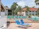 Relaxing community lounge area with multiple lounge chairs and lush landscaping, perfect for enjoying the Florida sunshine at 4315 45Th W Ave # 103, Bradenton, FL 34210