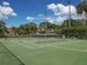 Well-maintained community tennis court surrounded by lush landscaping, perfect for enjoying a game with friends at 4315 45Th W Ave # 103, Bradenton, FL 34210