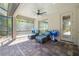 Comfortable outdoor living space, complete with fan and seating near pool at 437 Chantilly Trl, Bradenton, FL 34212