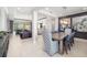 Open-concept living area seamlessly integrates a dining room with a view into other living spaces at 437 Chantilly Trl, Bradenton, FL 34212