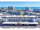 Stunning aerial view of the condo complex with ocean views and boat docks at 4380 Exeter Dr # 304, Longboat Key, FL 34228