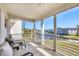 Relaxing screened balcony features comfortable seating and gorgeous water views at 4380 Exeter Dr # 304, Longboat Key, FL 34228