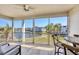 Enjoy picturesque waterfront views from this inviting screened balcony with tiled floor at 4380 Exeter Dr # 304, Longboat Key, FL 34228
