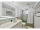 Bathroom featuring an integrated sink, shower and bathtub at 4380 Exeter Dr # 304, Longboat Key, FL 34228