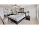 Bedroom with a large bed, a ceiling fan, a closet, and a window at 4380 Exeter Dr # 304, Longboat Key, FL 34228