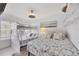Bright bedroom with bunk beds, queen bed, and coastal decor at 4380 Exeter Dr # 304, Longboat Key, FL 34228