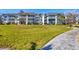 Well maintained condominium complex featuring lush green landscaping and inviting sidewalks at 4380 Exeter Dr # 304, Longboat Key, FL 34228