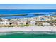 Scenic coastal view showcasing beachfront condos, clear ocean water, and picturesque islands at 4380 Exeter Dr # 304, Longboat Key, FL 34228