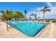 Community pool offers lounge chairs, waterfront views, and access to beautifully maintained condominiums at 4380 Exeter Dr # 304, Longboat Key, FL 34228