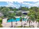 Overhead shot of the community pool with a view of the condos and surrounding trees and landscaping at 4380 Exeter Dr # 304, Longboat Key, FL 34228