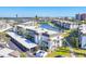 Condominium complex with covered parking and lush landscaping with views of marina and docked boats at 4380 Exeter Dr # 304, Longboat Key, FL 34228