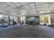 Bright gym with cardio machines, weights, mirrors, and large windows offering scenic views for workouts at 4380 Exeter Dr # 304, Longboat Key, FL 34228