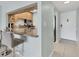View of kitchen with granite countertop, breakfast bar and stainless appliances at 4380 Exeter Dr # 304, Longboat Key, FL 34228