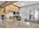 Charming kitchen featuring stainless steel appliances, granite countertops, and breakfast bar at 4380 Exeter Dr # 304, Longboat Key, FL 34228