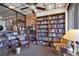 Cozy library featuring floor-to-ceiling bookshelves and comfortable seating for reading and studying at 4380 Exeter Dr # 304, Longboat Key, FL 34228