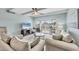 Bright living room showcasing neutral decor, a view of the balcony, and comfortable furnishings at 4380 Exeter Dr # 304, Longboat Key, FL 34228