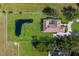 A property with a unique pond and landscaping, completely surrounded with privacy fencing at 4610 13Th W St, Palmetto, FL 34221