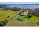 Waterfront property features a private pond, fenced yard, mature trees with partial lake view at 4610 13Th W St, Palmetto, FL 34221
