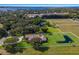 Aerial view of sprawling property featuring a large estate home with pond and surrounding pastures at 4610 13Th W St, Palmetto, FL 34221