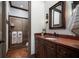 Stylish bathroom featuring custom wood vanity, modern fixtures, and a glass-enclosed shower, for a spa-like experience at 4610 13Th W St, Palmetto, FL 34221