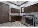 Functional laundry room equipped with a washer, dryer, ample counter space, and custom cabinets at 4610 13Th W St, Palmetto, FL 34221