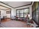 This sun-filled living area has a large window, neutral paint, hardwood floors and many features at 4610 13Th W St, Palmetto, FL 34221
