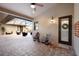 Covered outdoor patio with brick flooring, ceiling fans, and seating area at 4610 13Th W St, Palmetto, FL 34221