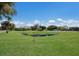 Backyard with a private pond, green grass, and a view of the house at 4610 13Th W St, Palmetto, FL 34221
