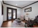 Cozy sitting room features hardwood floors, french doors, and stylish furniture at 4610 13Th W St, Palmetto, FL 34221