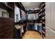Large walk-in closet featuring custom shelving and ample storage space for shoes, accessories, and hanging clothes at 4610 13Th W St, Palmetto, FL 34221