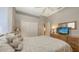 Comfortable bedroom with a dresser, closet, and neutral color palette at 4832 Carrington Cir, Sarasota, FL 34243