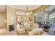 Casual dining area with open access to living areas and views of the pool at 4832 Carrington Cir, Sarasota, FL 34243