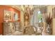 Dining room with decorative chandelier, elegant furnishings and natural light at 4832 Carrington Cir, Sarasota, FL 34243