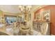 Dining area with chandelier, seating for four, and a buffet area at 4832 Carrington Cir, Sarasota, FL 34243